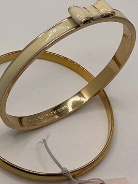 Kate Spade New York TAKE A BOW Gold & Cream/Idiom Gold-Tone Bangle Bracelet